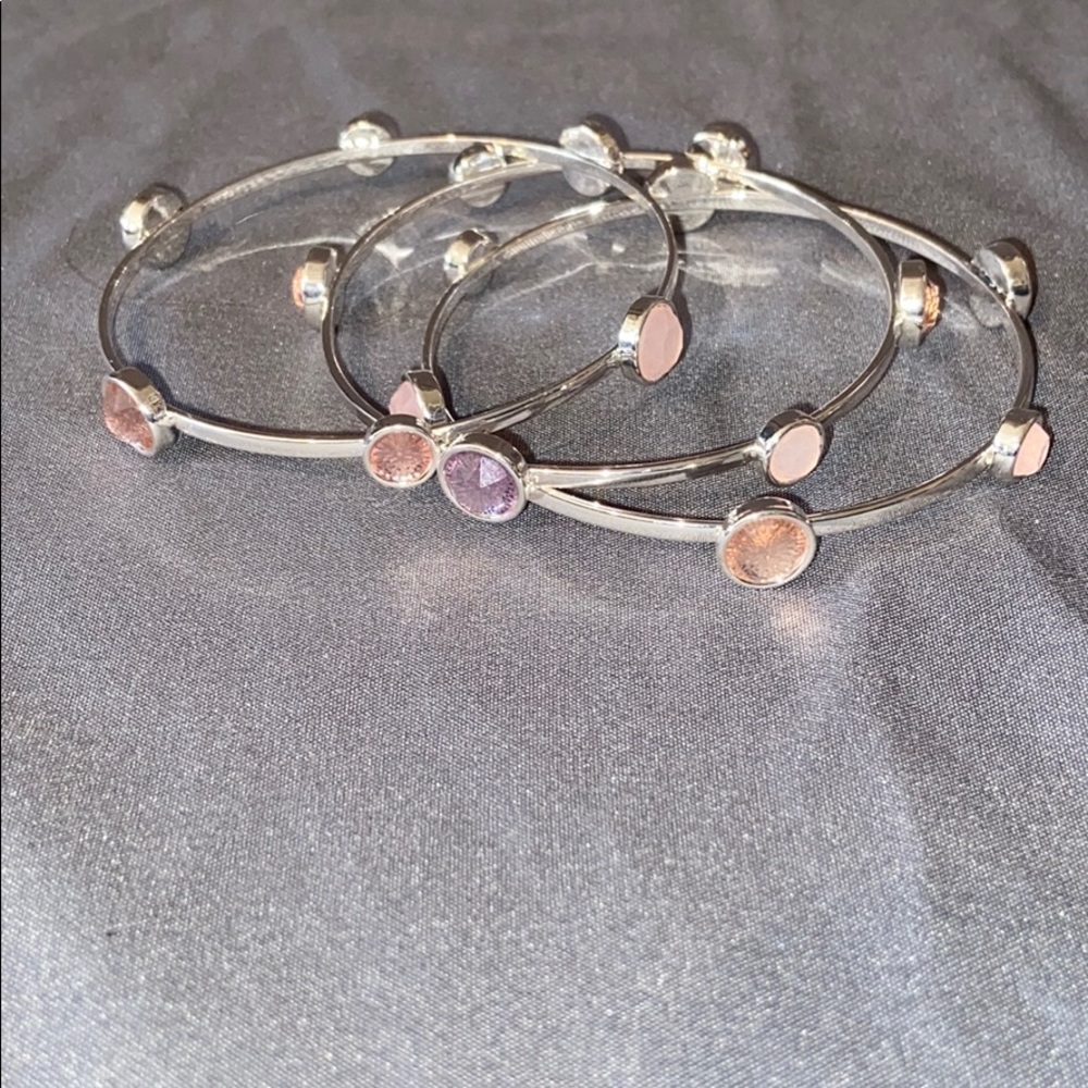 3 bracelets with pink jewels